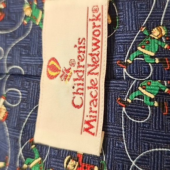 Men's Blue Holiday Tie. With Children Ice Skaters. Childrens Miracle Network - Picture 2 of 5